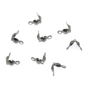 Detailed view of gunmetal jewelry fold-over cord ends and knot covers for DIY assembly