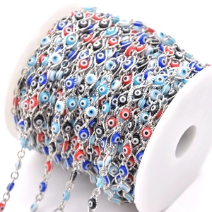 Colorful evil eye chain on a spool for DIY jewelry making and necklace crafts