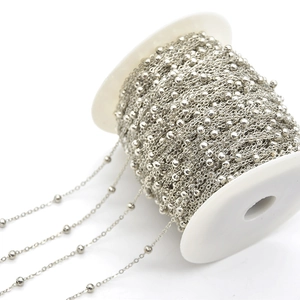 Macro shot of a roll of silver ball chain for DIY jewelry making and tassels