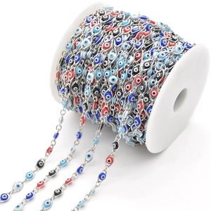 Colorful evil eye bead chain on spool for DIY jewelry making with diverse enamel beads