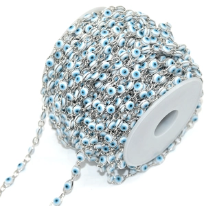 Macro shot of silver evil eye chain roll for DIY jewelry making and necklace crafts