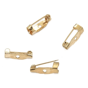 Detailed view of four golden safety pin bases for DIY jewelry making and craft projects