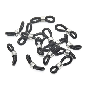 Detail shot of black silicone eyeglass chain ends with silver adjustable metal coils