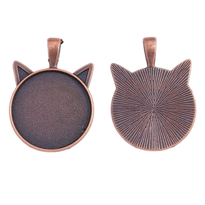 Detailed front and back views of a vintage bronze cat ear bezel pendant setting
