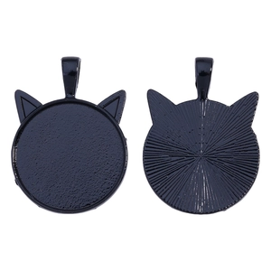 Detail of black cat-ear alloy pendant base showing front tray and textured back