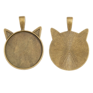 Antique bronze cat ear pendant tray showing front inlay space and textured back detail