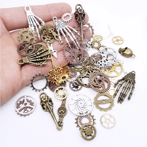 Detailed collection of steampunk gears, skull bones and clock hands for DIY jewelry