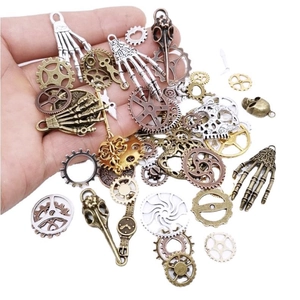 Steampunk DIY jewelry kit with bronze gears, metal skull and skeleton hand charms