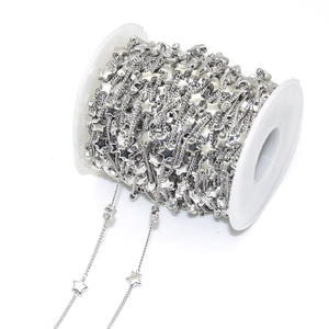 Macro shot of silver plated star bead chain roll for DIY handmade jewelry crafts