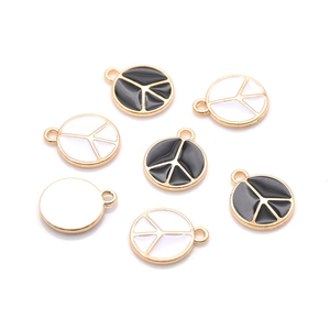Fashionable enamel peace symbol pendants in black and white with gold metal plating