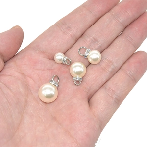 DIY ivory pearl charms with rhinestone-encrusted silver loops for jewelry making