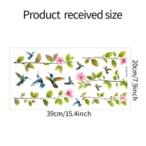 Guide des dimensions pour stickers de fenêtre colibri et fleurs montrant la taille 39x20cm