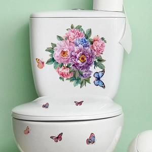 Detailed view of colorful peony flower and butterfly decals on a white ceramic toilet lid