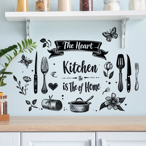 Black kitchen wall decal featuring The Kitchen is The Heart of The Home lettering and utensils