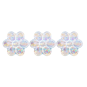 Three rainbow laser floral window decals with prismatic finish on a white background