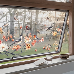 Detail of floral and bird window static cling showing realistic finches and blossoms
