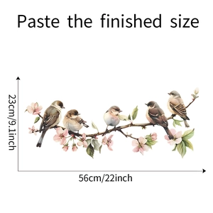 Detail view of bird on flowering branch window sticker with dimensions 56x23cm