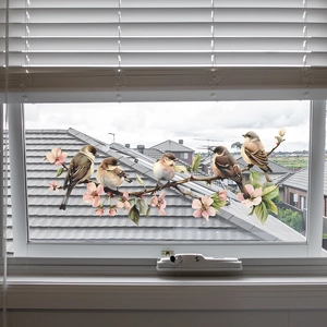 Detail of static window cling featuring realistic birds on blooming pink flower branches