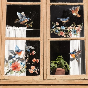 Detailed realistic bird and flower window stickers on vintage wooden frame with sunlight