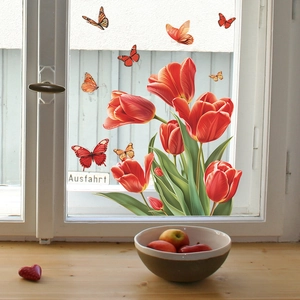 Vibrant red tulip and butterfly static window stickers on a white wooden glass frame
