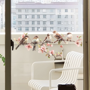 Detailed view of colorful birds and pink blossoms on static cling glass window film