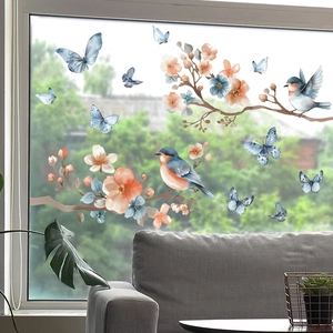 Detail of floral window decals showing watercolor cherry blossoms and blue birds