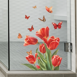 Close-up of red tulip and colorful butterfly static window film on glass door