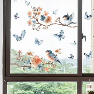 Detailed close-up of bird and floral static cling window sticker on glass background