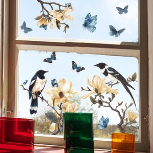 Decorative static cling window film featuring magnolia flowers, magpies and blue butterflies
