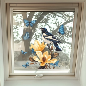 Static cling window film featuring magnolia blossoms, a magpie, and blue butterflies