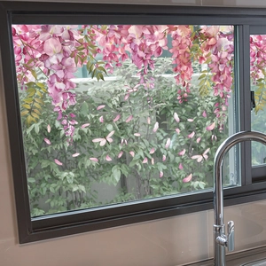 Detail view of floral window static cling with purple wisteria and dragonflies