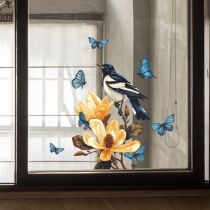 Detail of static window cling featuring magnolia flowers, blue birds and butterflies