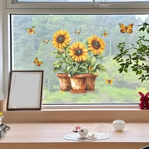 Detailed view of sunflower window stickers with colorful butterflies on glass surface