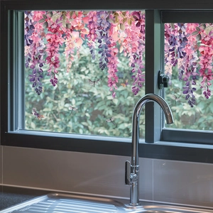 Detail of wisteria floral window film with dragonflies on kitchen glass surface