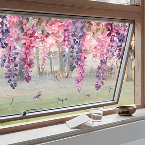 Static cling window film with purple wisteria flowers and dragonflies on a glass pane