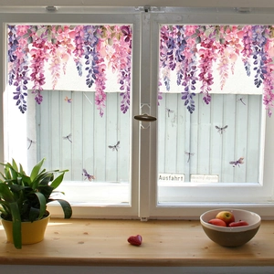 Detailed view of floral window stickers with wisteria flowers and dragonflies on glass