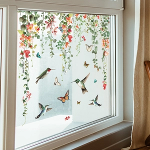 Floral green vine static glass window decals featuring hummingbirds and colorful butterflies