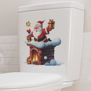 Detail view of cartoon Santa Claus chimney sticker on white toilet tank background