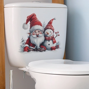 Détail d'autocollant WC de Noël avec Père Noël et bonhomme de neige sur réservoir céramique