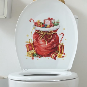 Festive Christmas toilet lid sticker featuring a red gift bag, boxes, and candy canes