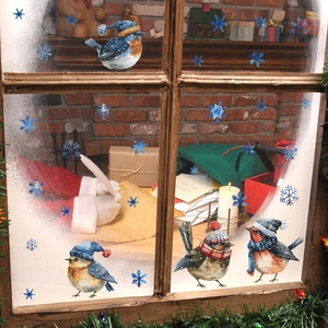 Detailed watercolor Christmas window stickers with blue snowflakes and festive cartoon birds