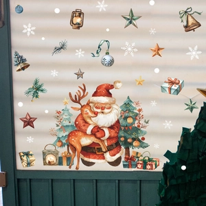 Detail of Christmas window stickers featuring Santa, reindeer, and festive watercolor elements