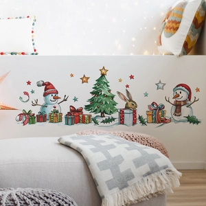 Close-up of festive Christmas wall stickers featuring snowmen and a tree on a white wall