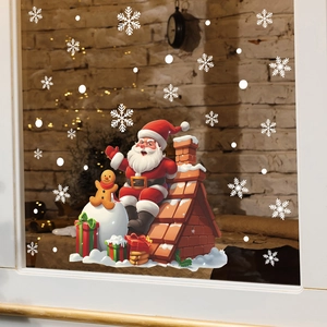 Close-up of Santa Claus window sticker with white snowflakes on glass surface