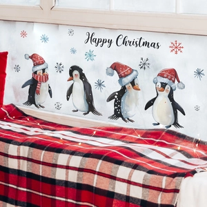 Detail of Christmas wall decals with penguins, snowflakes and Happy Christmas text sticker