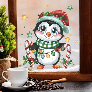 Detail of Christmas penguin window sticker with Santa hat and candy canes for home decor