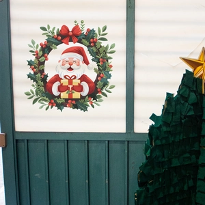 Sticker mural de Noël avec couronne du Père Noël et plantes vertes pour décor de fête