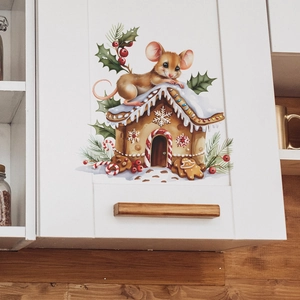 Christmas mouse and gingerbread house wall sticker applied on white kitchen cabinet surface