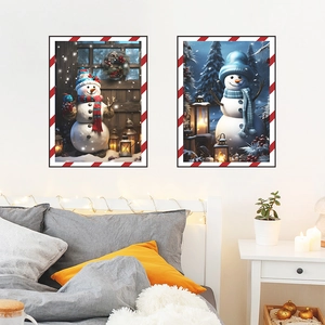 Set of two Christmas snowman wall art prints with festive red and white striped frames