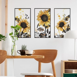 Three-piece sunflower wall art set with yellow petals and gold ink in black frames